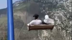 Terrifying Moment Two People Fall From Swing On The Edge Of 6,000-Foot Cliff