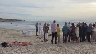 Woman Pictured Sunbathing Metres Away From A Wedding In Australia