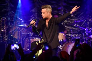 Robbie Williams Caught Using Hand Sanitiser After Touching Fans 