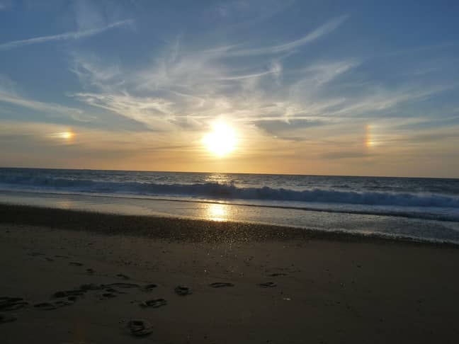 Sun dogs, or parhelia, are caused by refraction of sunlight by ice crystals in the atmosphere