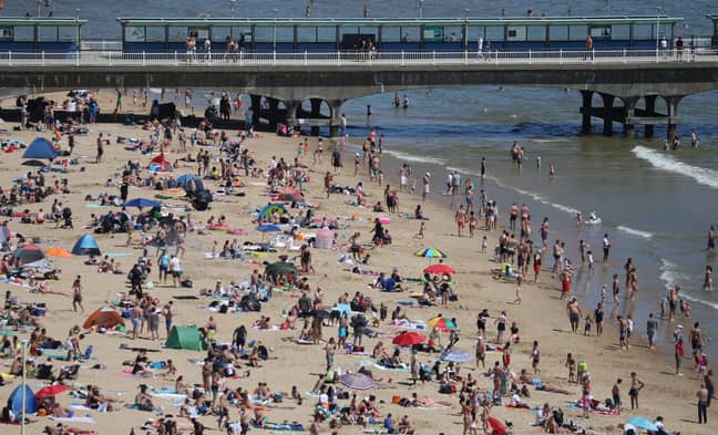 People enjoy the hot weather on Bournemouth beach. Credit: PA