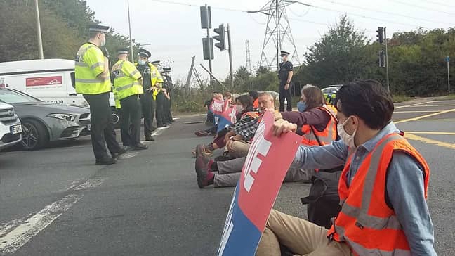 Insulate Britain protesters on the M25 yesterday. Credit: PA