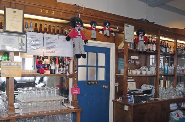 Chris and his wife have 15 Gollywog dolls behind the bar. Credit: Eastnews Press Agency