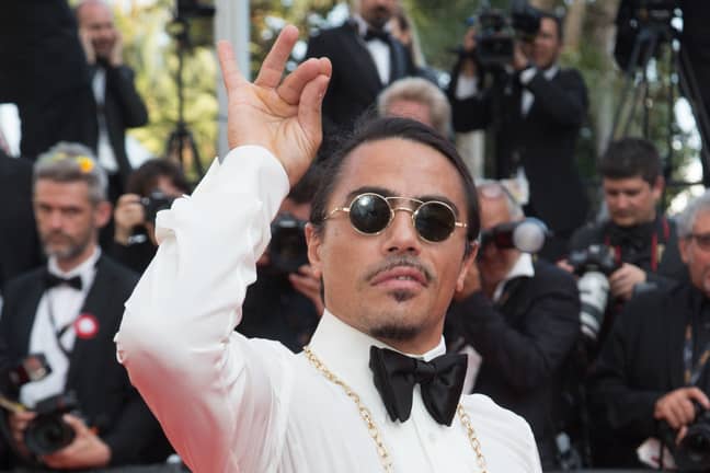 Salt Bae doing his iconic salt sprinkling action on the red carpet at the Cannes Film Festival in 2019. (Credit: PA)