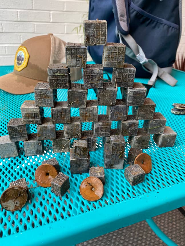 Magnet Fisherman Finds Haul Of Mysterious Engraved Cubes