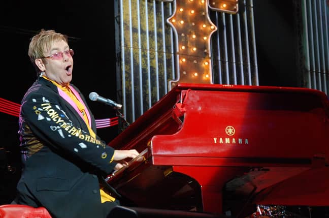 Elton John performing his Red Piano tour at the O2 Arena. Credit: PA