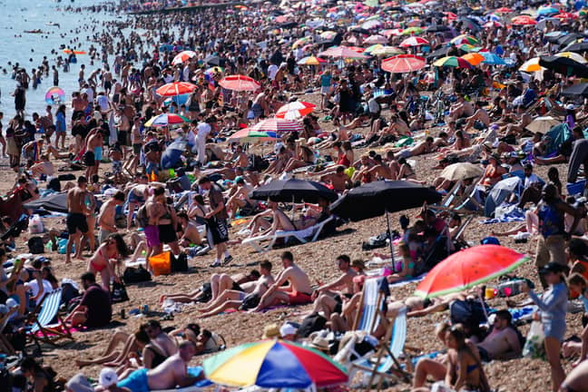 People enjoying the hot weather in Brighton on Sunday. Credit: PA