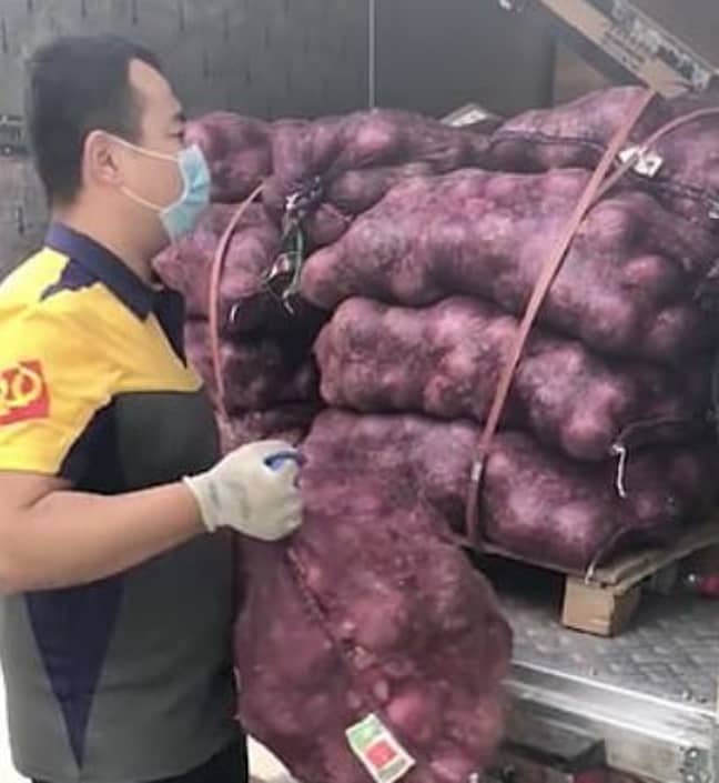 It took the deliver driver four hours to transfer the veg. Credit: Zhejiang Television/Weibo