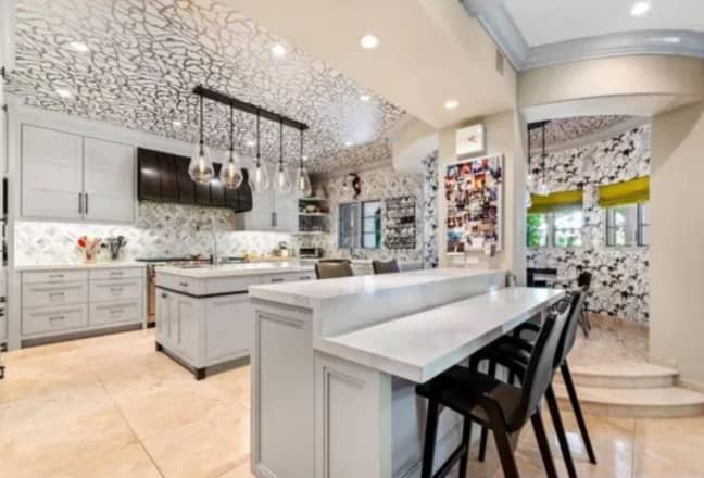 Amongst other things, the property has a movie theatre, a lavish master suite with three walk-in closets and a huge chef's kitchen. (Credit: Keller Williams Realty)
