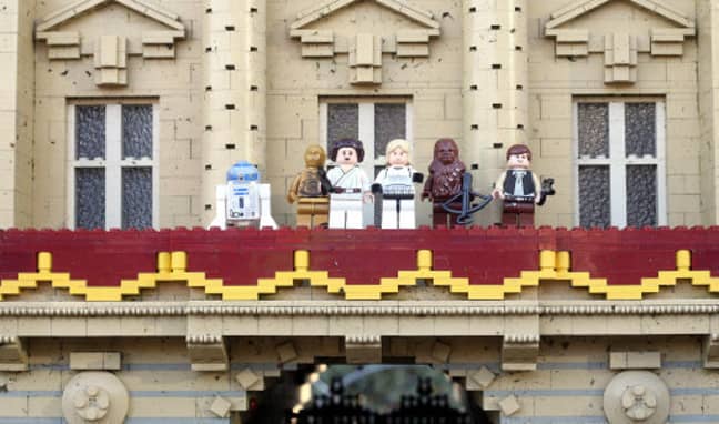 Luke Skywalker and Princess Leia are joined on the balcony of Buckingham Palace by (from left to right) R2-D2, C-3PO, Chewbacca and Han Solo. Credit: PA