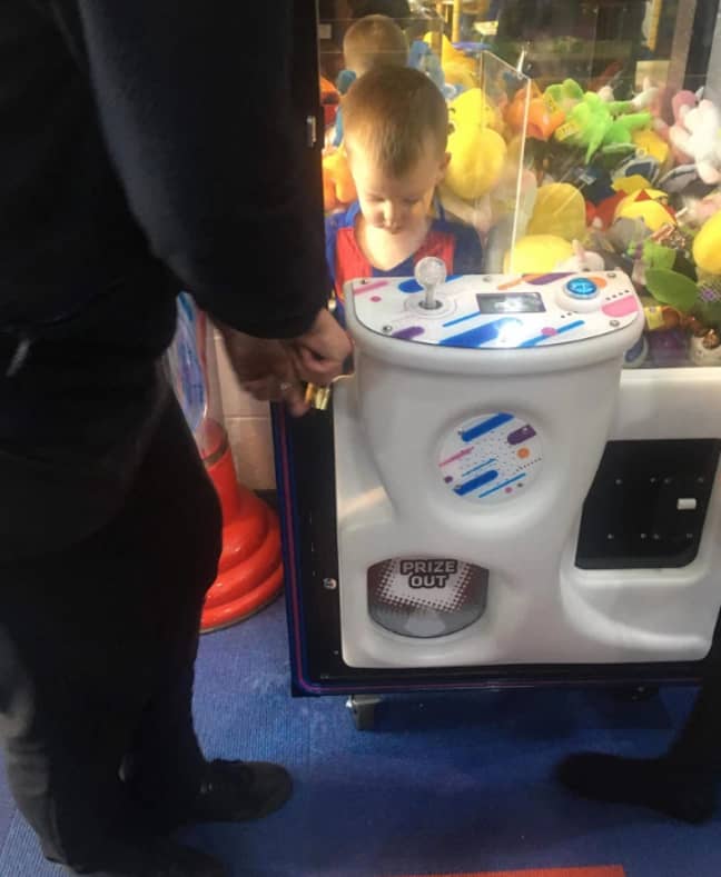 Noah got stuck in an arcade claw machine trying to get a teddy bear. Credit: Caters