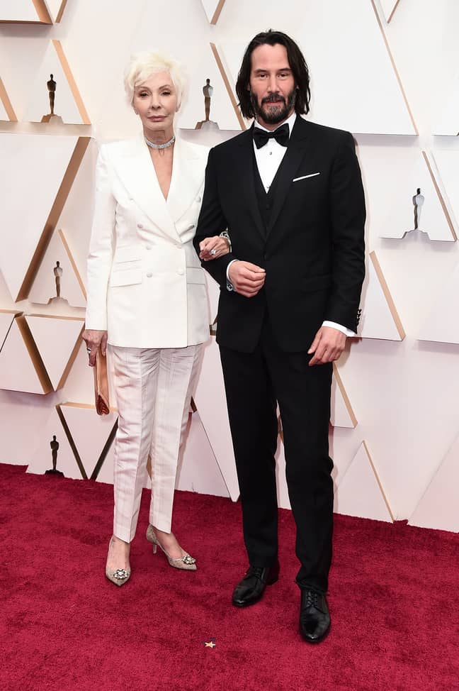 Patricia Taylor, left, and Keanu Reeves arrive at the Oscars. Credit: PA