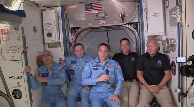Bob Behnken and Doug Hurley, far right, joining the the crew at the International Space Station. Credit: PA