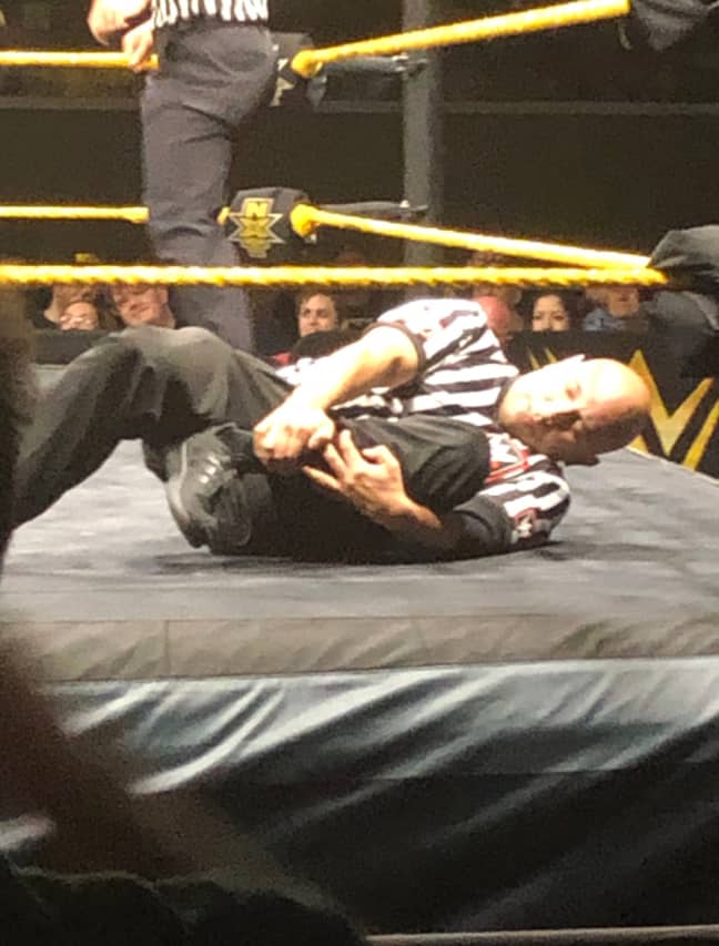 The shocking footage shows the referee rolling on the canvas with his ankle facing the wrong way. Credit: Twitter/@nardawg360