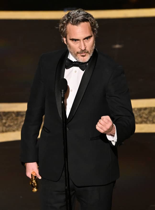 Joaquin Phoenix picking up his award for Best Actor. Credit: Shutterstock