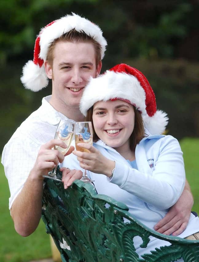20-year-old lottery winners Stuart Meek and Gemma Jones from Gloucestershire celebrate with champagne in Cheltenham. Credit: PA