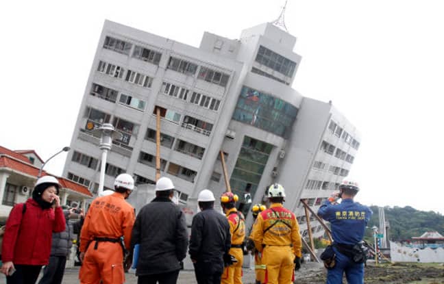 Workers survey the damage from the Taiwanese earthquake. Credit: PA