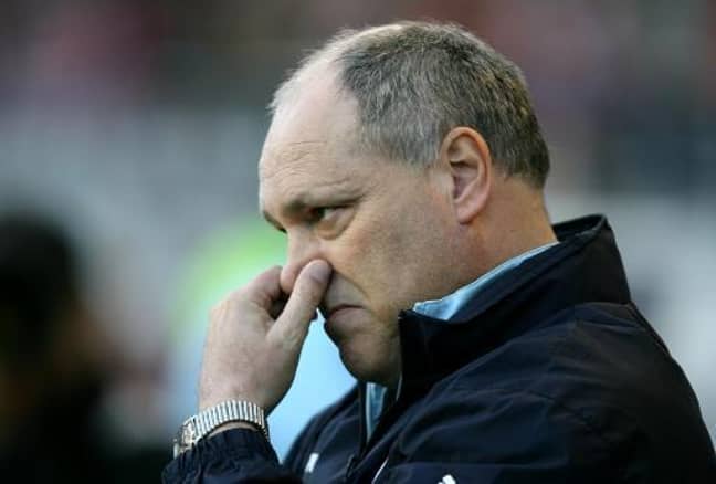 Martin Jol here, possibly trying to stop a fart invading his nostrils. Credit: PA