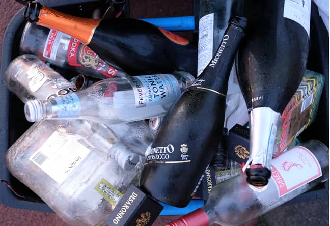 Stock image of empty bottles in a recycling bin. Credit: PA