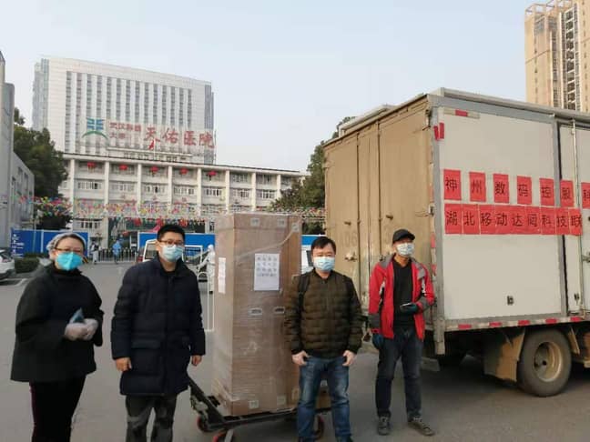 CloudMinds employees unload a robot shipment at Wuhan's Tongji Tianyou Hospital. Credit: CloudMinds
