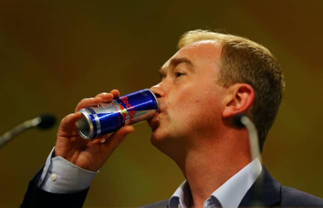 Former Lib Dem leader Tim Farron downing a Red Bull. Credit: PA