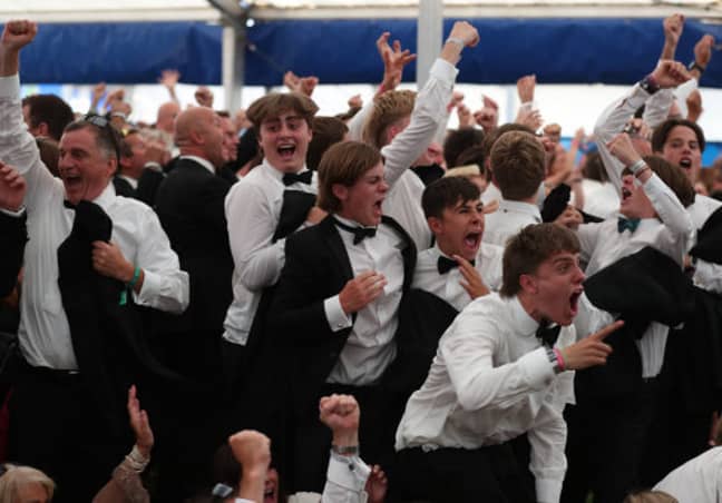 Fans at the Henley Festival celebrate England's goal from Keiran Trippier. Credit: PA