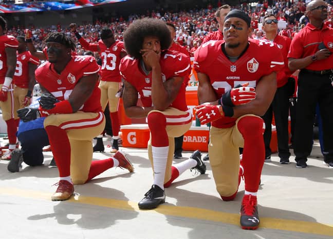 Colin Kaepernick and his teammates kneels in protest before an NFL game. Credit: PA