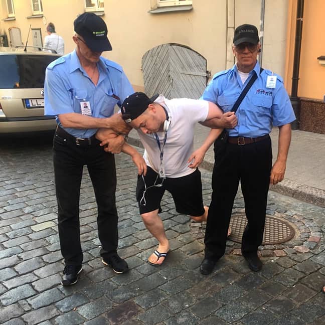 One of Ainars' posts shows him collapsed in the arms of security guards. Credit: Jam Press