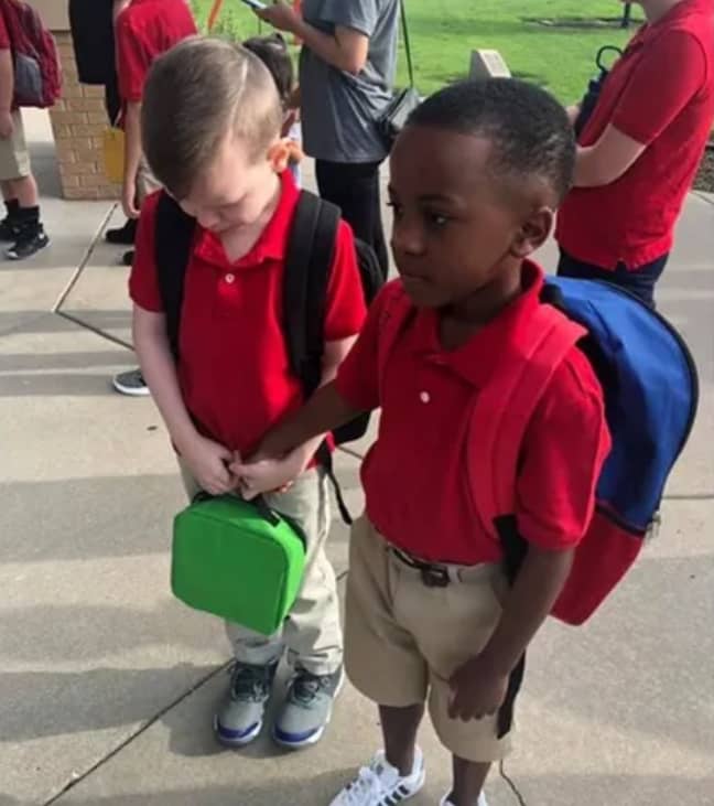 Christian saw Connor crying on their first day of school and rushed over to hold his hand. Credit: Courtney Moore