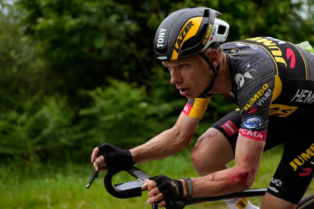 German cyclist Tony Martin rides with injuries to his arm after the incident. Credit: PA