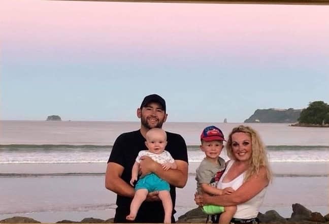 Russell, his wife Beth, and their two kids. Credit: Supplied