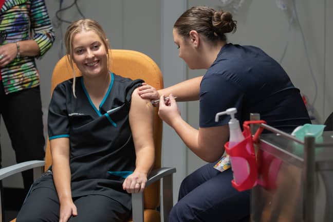 Nurse Maddy Williams receives the Covid-19 vaccine in Canberra. Credit: PA