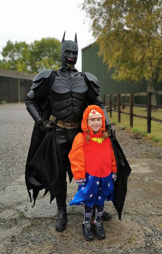 Carmela was greeted by Batman at the finish line. Credit: Muscular Dystrophy UK
