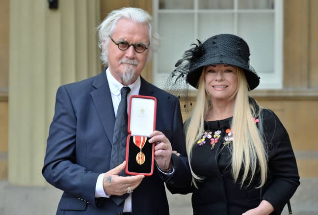 Sir Billy Connolly with his wife Pamela Stephenson after being knighted by the Duke of Cambridge. Credit: PA