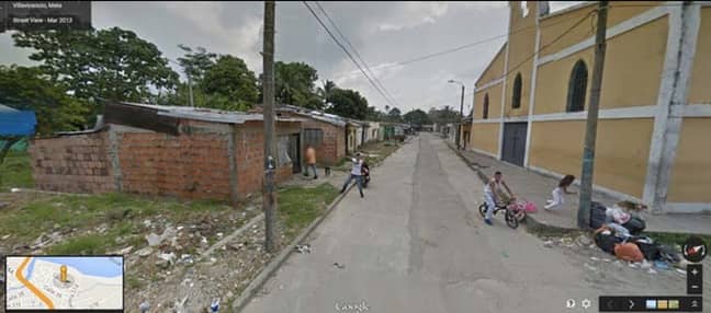 The unnamed man points his weapon at the Google Maps camera Credit: Google Street View