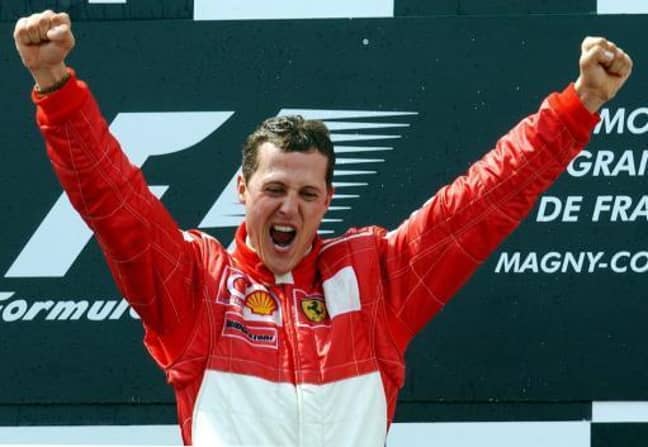 Michael Schumacher celebrates after winning the French Formula One Grand Prix on the Magny-Cours racetrack in France, 21 July 2002. Credit: PA