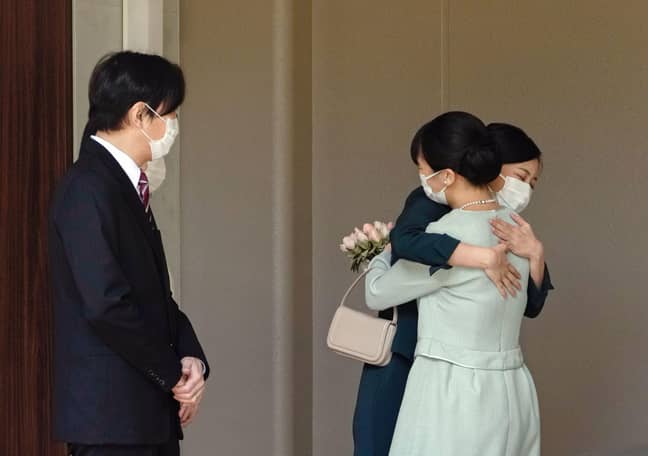 Princess Mako hugs her sister as she leaves the royal household. Credit: Alamy