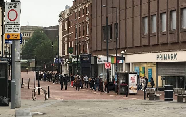 Shoppers queue outside the Derby store, in scenes that are echoed across the country. Credit: Twitter/Josh Buckley