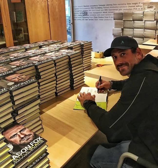 Jason, pictured signing his book, said he started to feel better after visiting a therapist. Credit: Instagram/jason_carl_fox