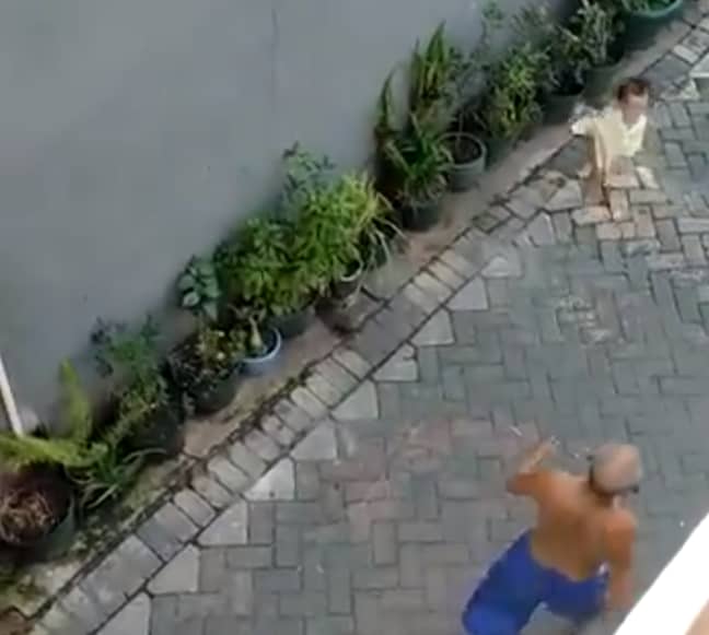A man intervenes and the girl runs back to her family. Credit: Twitter