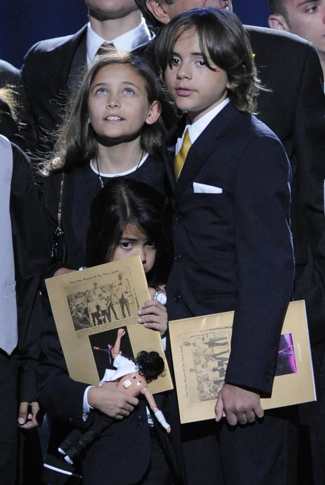 Paris with her brothers during a memorial service for Michael Jackson. Credit: PA