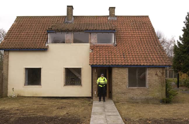 A police officer stands outside Ian Huntley's home. Credit: PA