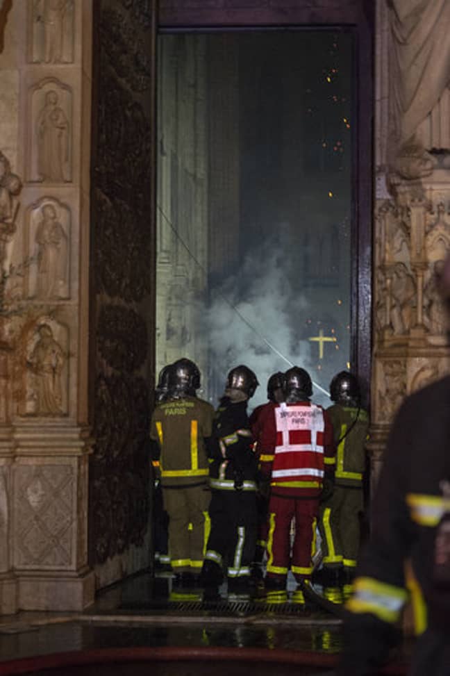 Firefighters work to put out Notre Dame blaze. Credit: PA
