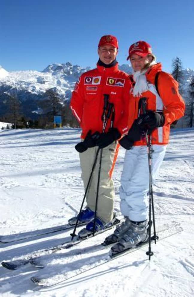 Michael Schumacher poses with his wife Corinna on a piste during the traditional three-day Ferrari meeting in Madonna di Campiglio. Credit: PA