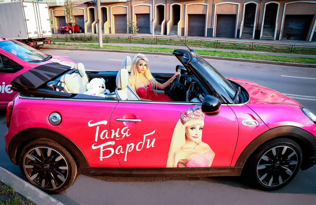 Tatiana driving her pink (obviously) Mini Cabrio. Credit: East2West News