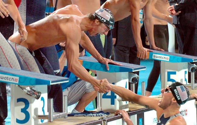 Keller being congratulated by team mate Michael Phelps in the 2004 Olympics. Credit: PA