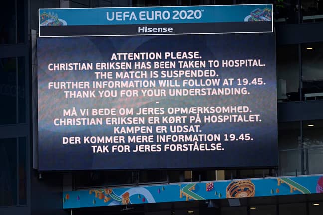 A video screen announces that Denmark's Christian Eriksen has been taken to hospital and the game is suspended. Credit: PA