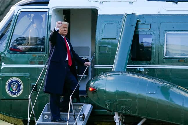 rump gestures as he boards Marine One on the South Lawn of the White House on January 20, 2021. Credit: PA