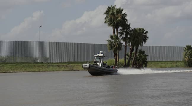 Tommy Fisher's border wall runs along the Rio Grande river near Mission, Texas. Credit: Eric Gay/AP/Shutterstock