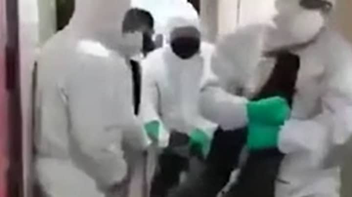 Footage Shows Suspected Coronavirus Patients Being Dragged From Their Homes 